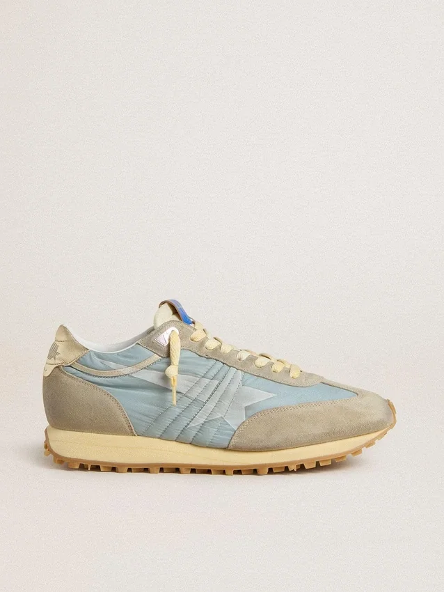 Marathon para mujer con parte superior de nylon azul claro y estrella azul pastel