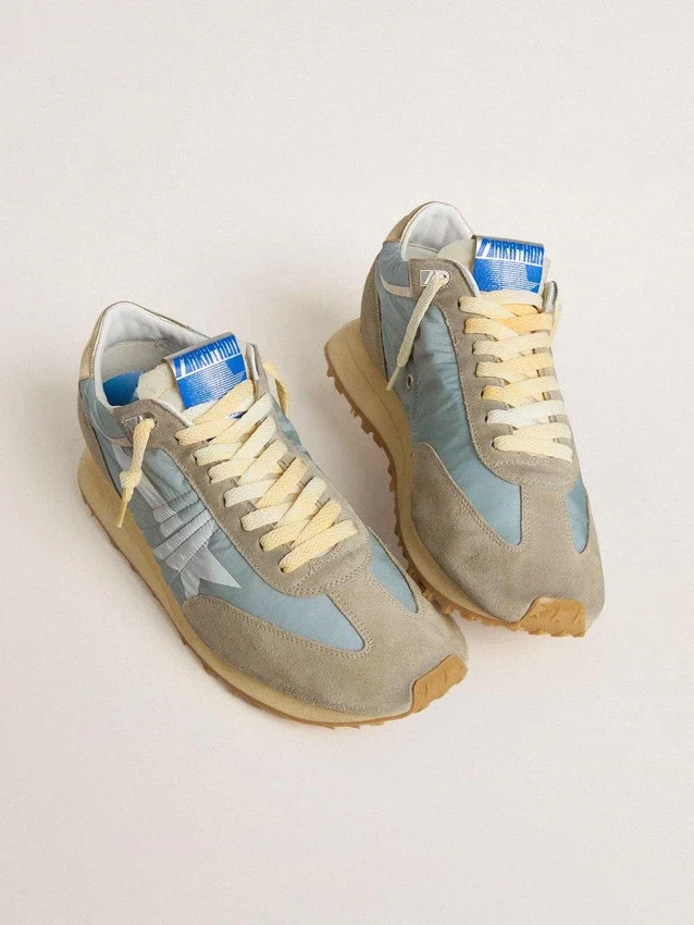 Marathon para mujer con parte superior de nylon azul claro y estrella azul pastel