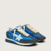Marathon para mujer con parte superior de nylon azul y estrella blanca