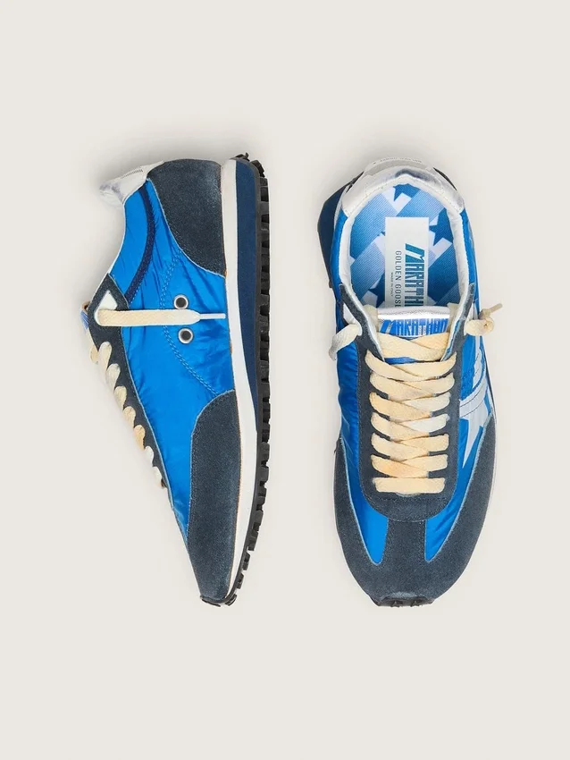 Marathon para mujer con parte superior de nylon azul y estrella blanca