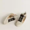 Mid Star para mujer en piel naplak beige con estrella de piel de potro con estampado de leopardo