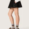 Minifalda para mujer en sarga de algodón negra con bordado floral de lentejuelas