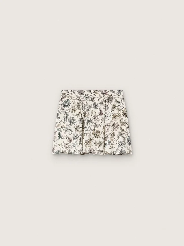 Minifalda para niñas «Journey» de lona de algodón blanca con estampado floral verde