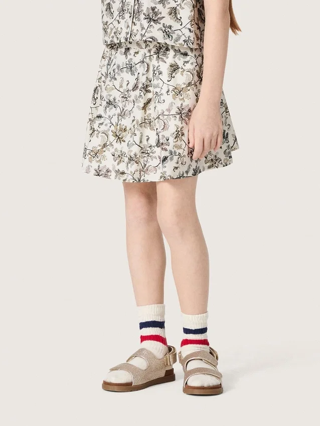 Minifalda para niñas «Journey» de lona de algodón blanca con estampado floral verde
