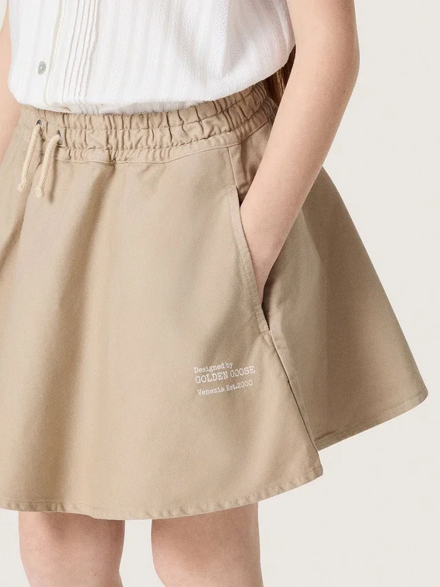 Minifalda para niñas «Journey» en gabardina de algodón beige con estampado