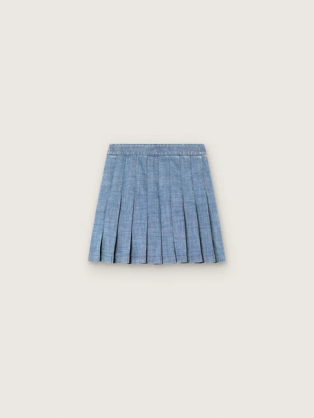 Minifalda plisada para niñas «Journey» en chambray de algodón azul claro con logotipo bordado