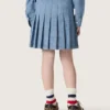 Minifalda plisada para niñas «Journey» en chambray de algodón azul claro con logotipo bordado