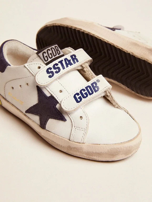 Old School Junior en cuero blanco con estrella de gamuza azul y lengüeta en el talón