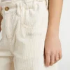 Pantalones anchos de niñas en color crema con costuras acanaladas y bordados