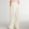 Pantalones anchos de niñas en color crema con costuras acanaladas y bordados