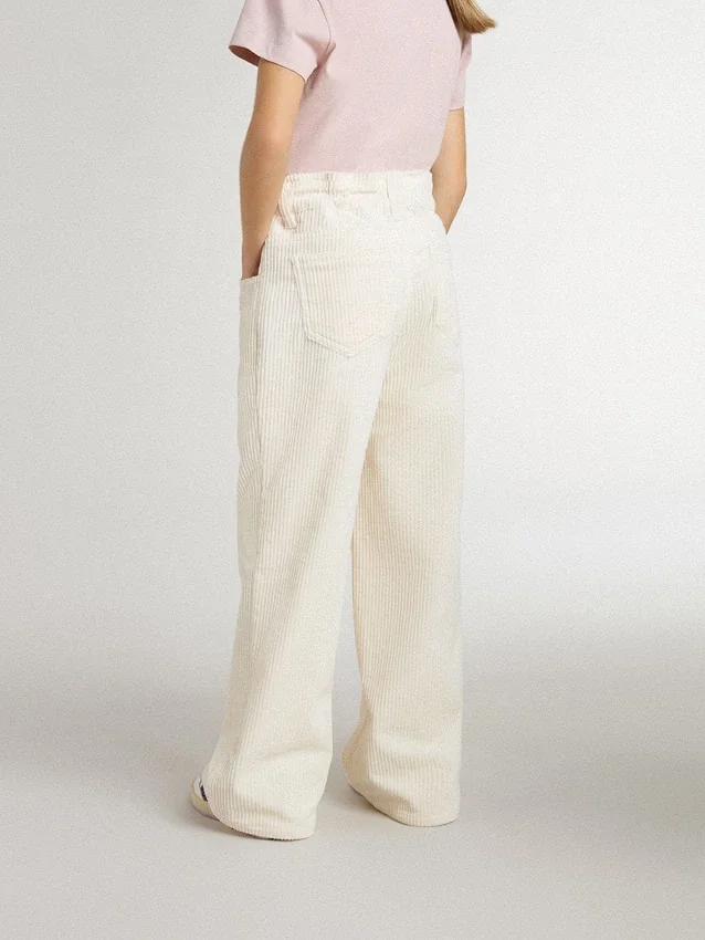 Pantalones anchos de niñas en color crema con costuras acanaladas y bordados