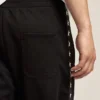 Pantalones de chándal negros para hombre con estrellas blancas en los costados