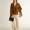 Pantalones de encaje transparente color crema para mujer
