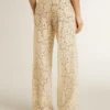 Pantalones de encaje transparente color crema para mujer