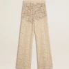 Pantalones de encaje transparente color crema para mujer