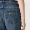 Pantalones de mezclilla de corte acampanado para niñas de la colección Journey en mezclilla azul con pedrería degradada