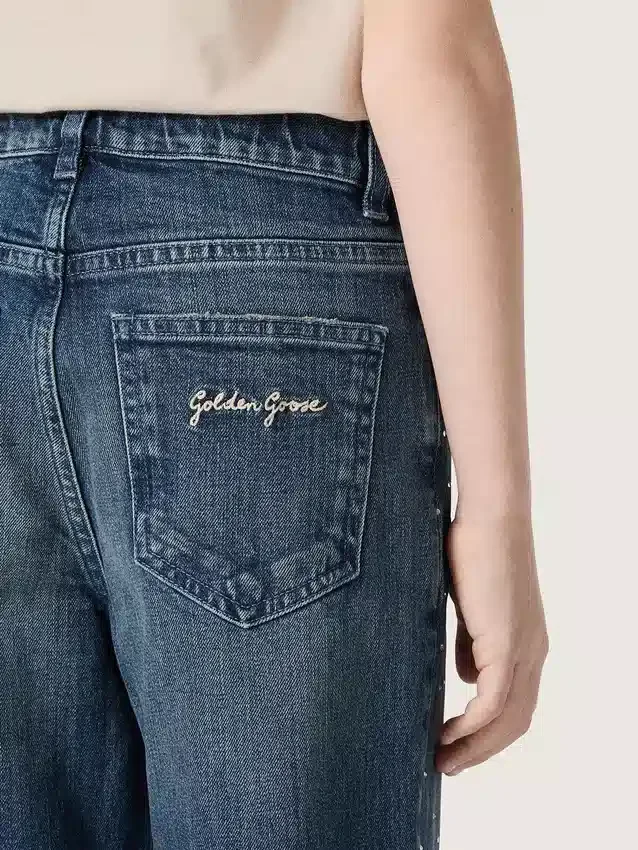 Pantalones de mezclilla de corte acampanado para niñas de la colección Journey en mezclilla azul con pedrería degradada