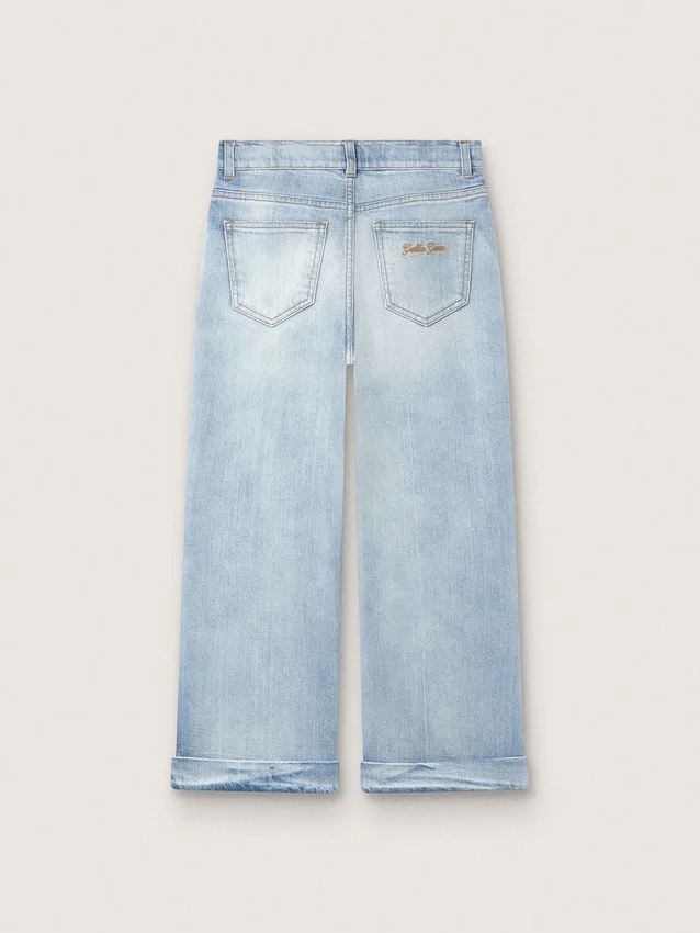 Pantalones de mezclilla de corte acampanado para niñas Golden en denim azul claro con un logotipo bordado