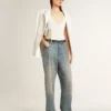 Pantalones de mezclilla lavados para mujer con ojales en toda la prenda