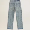 Pantalones de mezclilla lavados para mujer con ojales en toda la prenda