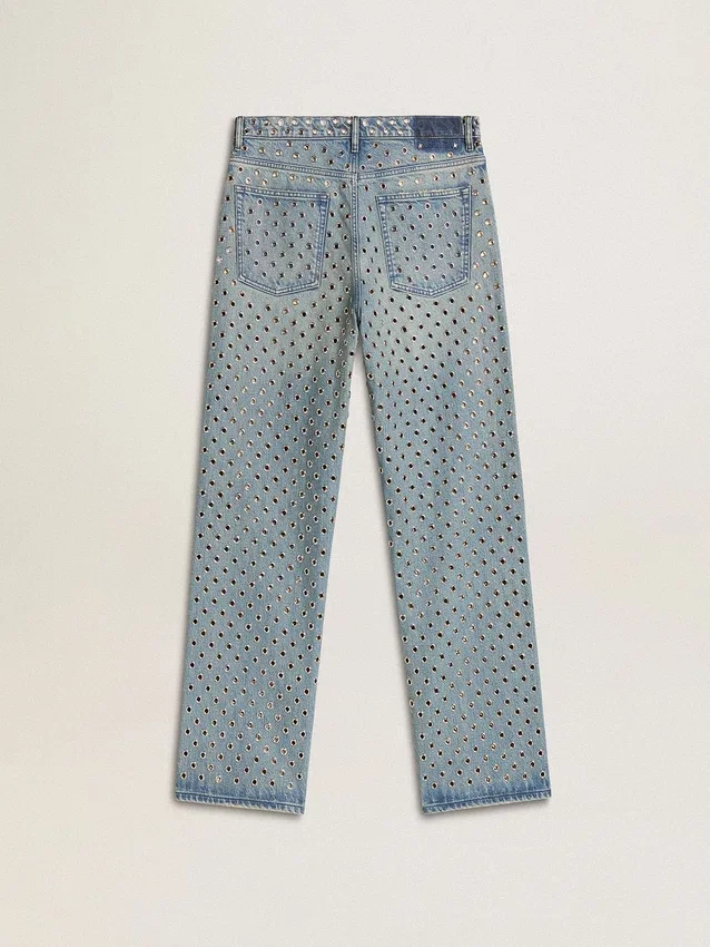 Pantalones de mezclilla lavados para mujer con ojales en toda la prenda