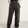 Pantalones de mezclilla negros desgastados para mujer con parches en la parte delantera