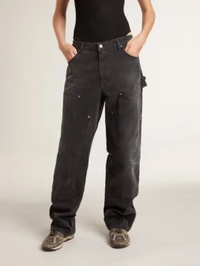 Pantalones de mezclilla negros desgastados para mujer con parches en la parte delantera