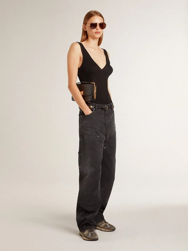 Pantalones de mezclilla negros desgastados para mujer con parches en la parte delantera