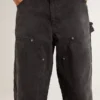 Pantalones de mezclilla negros desgastados para mujer con parches en la parte delantera