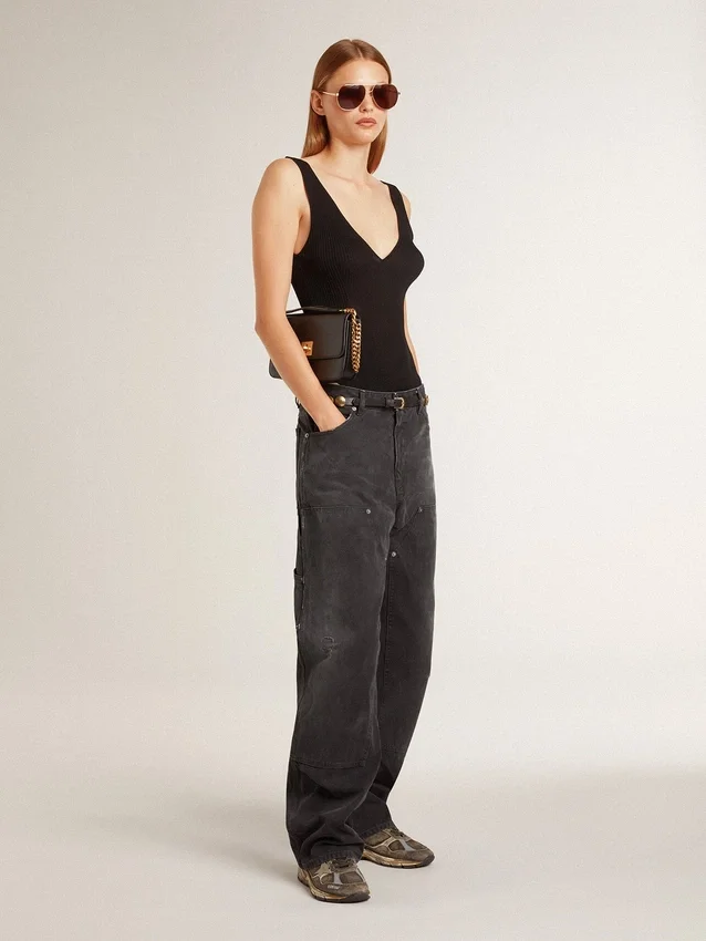 Pantalones de mezclilla negros desgastados para mujer con parches en la parte delantera