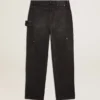 Pantalones de mezclilla negros desgastados para mujer con parches en la parte delantera