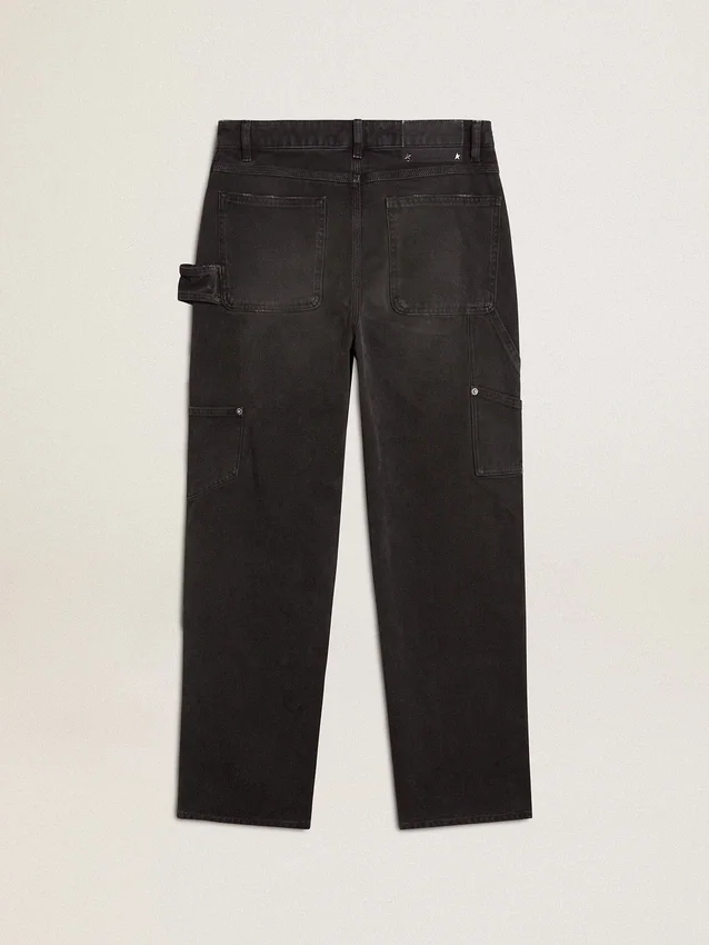 Pantalones de mezclilla negros desgastados para mujer con parches en la parte delantera