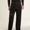 Pantalones de mezclilla negros para hombre con corte holgado y efecto degradado con cristales por toda la prenda