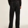 Pantalones de mezclilla negros para hombre con corte holgado y efecto degradado con cristales por toda la prenda