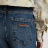 Pantalones de mezclilla para niñas con corte acampanado, lavado medio y bordados