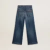 Pantalones de mezclilla para niñas con corte acampanado, lavado medio y bordados