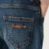 Pantalones de mezclilla para niños con bordes sin rematar y bordado