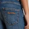 Pantalones de mezclilla para niños con bordes sin rematar y bordado