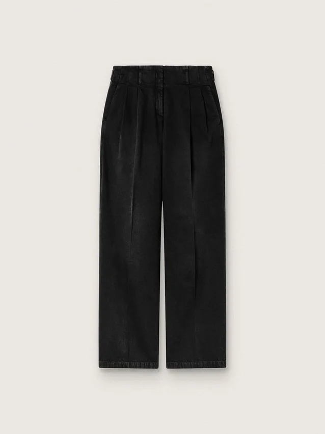 Pantalones de mujer en denim de algodón negro con acabado desgastado
