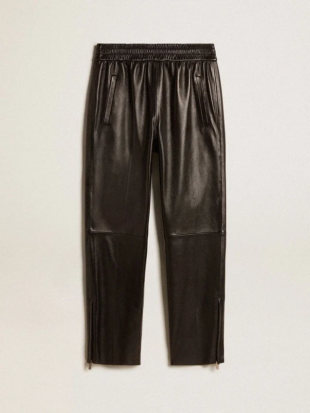 Pantalones deportivos negros de piel napa con cremallera en la parte inferior