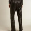 Pantalones deportivos negros de piel napa con cremallera en la parte inferior