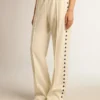 Pantalones joggers blancos para mujer con estrellas en los costados