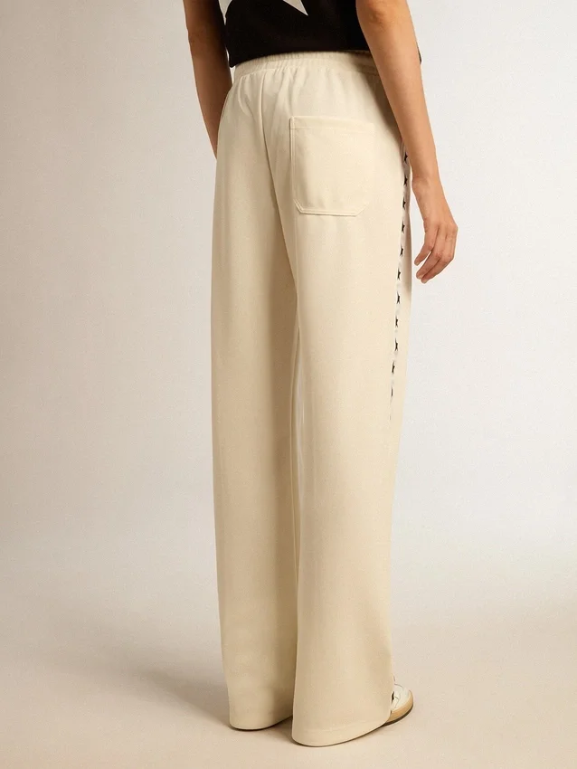 Pantalones joggers blancos para mujer con estrellas en los costados