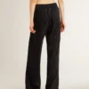 Pantalones joggers negros para mujer con estampado toile de jouy tono sobre tono