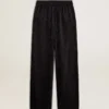 Pantalones joggers negros para mujer con estampado toile de jouy tono sobre tono