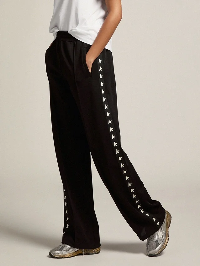 Pantalones joggers negros para mujer con estrellas blancas en los costados