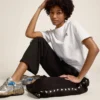 Pantalones joggers negros para mujer con estrellas blancas en los costados