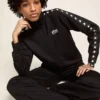 Sudadera negra con cremallera para mujer con estrellas blancas