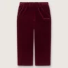 Pantalones para niñas de color burdeos con efecto terciopelo y bolsillo trasero