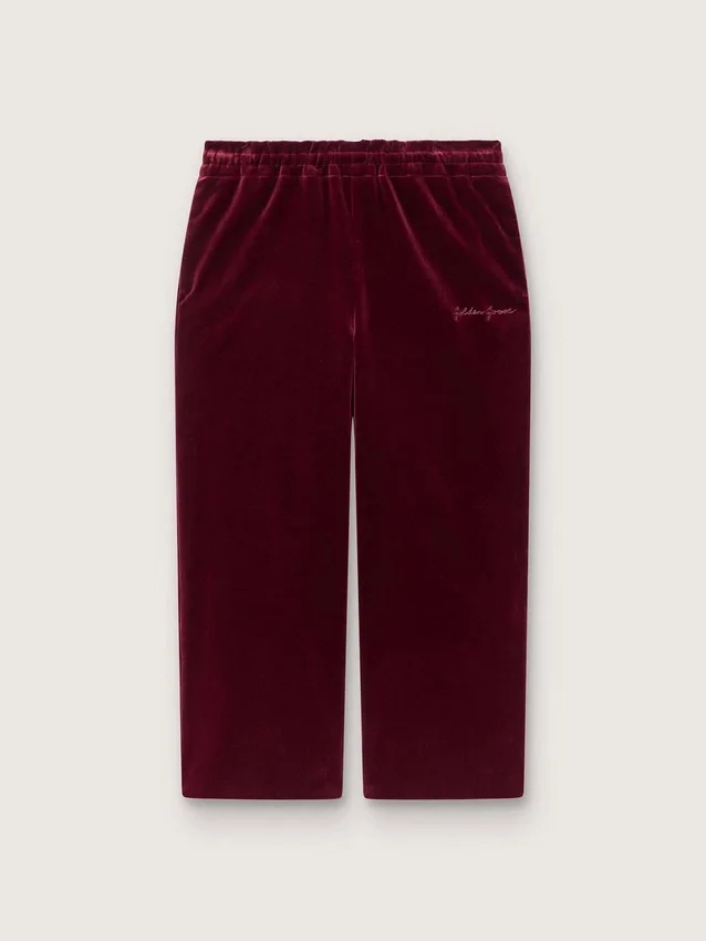 Pantalones para niñas de color burdeos con efecto terciopelo y bolsillo trasero